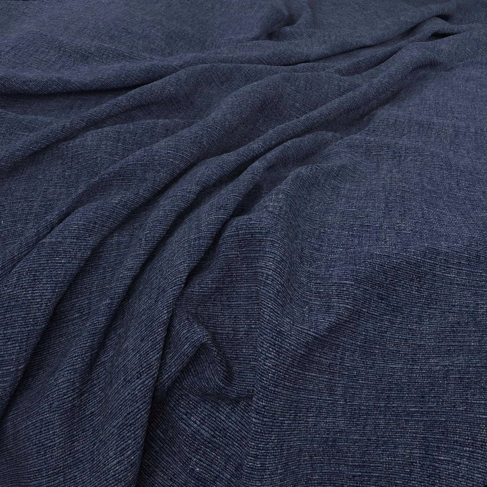 Deep navy woven fabric with fine horizontal texture gathered into soft folds