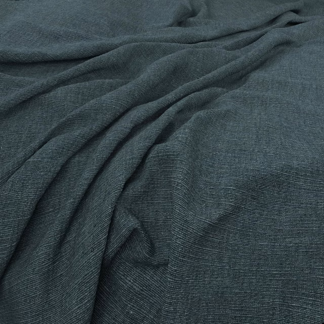 Deep Pacific teal fabric with fine ribbed weave gathered into soft flowing folds