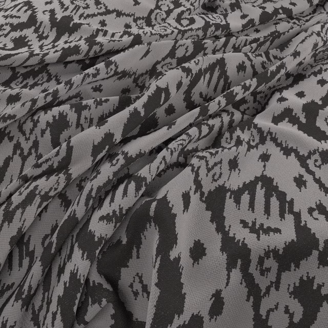 Cool grey and charcoal abstract motif on folded, textured woven fabric