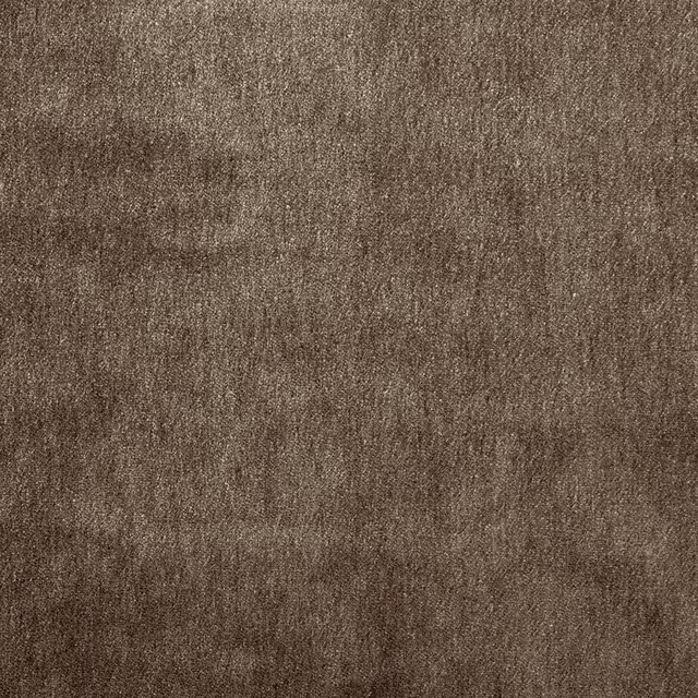 Close-up of warm nutmeg-brown plain mohair upholstery fabric with a soft, mottled texture