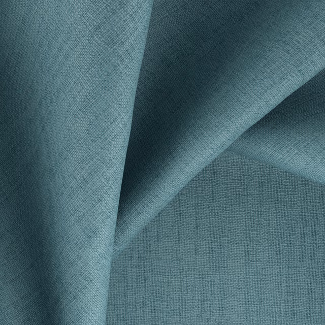 Muted azure-teal woven cloth with fine crosshatch texture and darker folded shadows