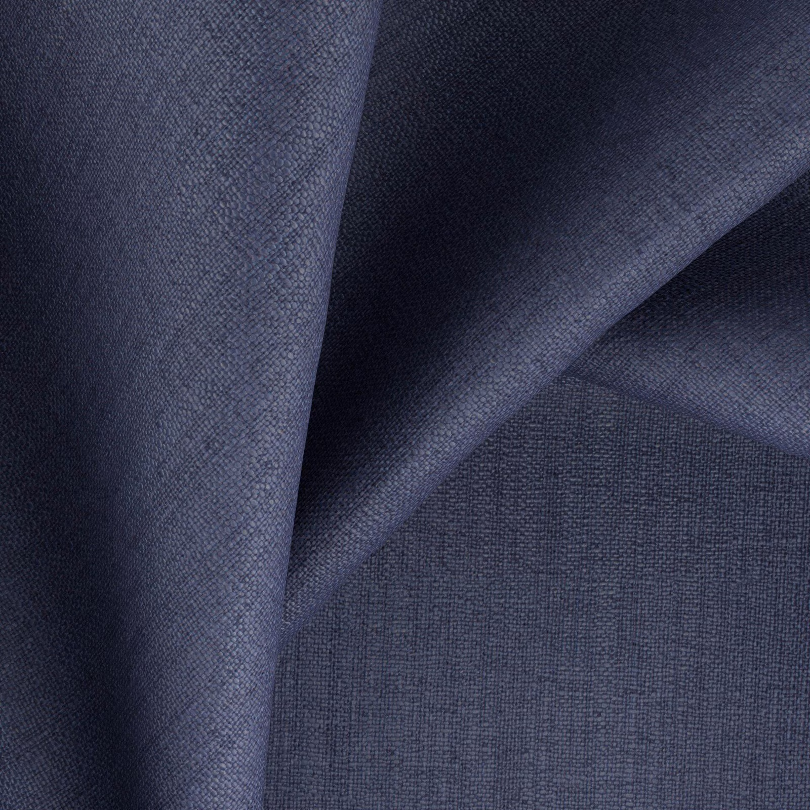 Folded swatch of deep denim blue fabric with a fine woven texture
