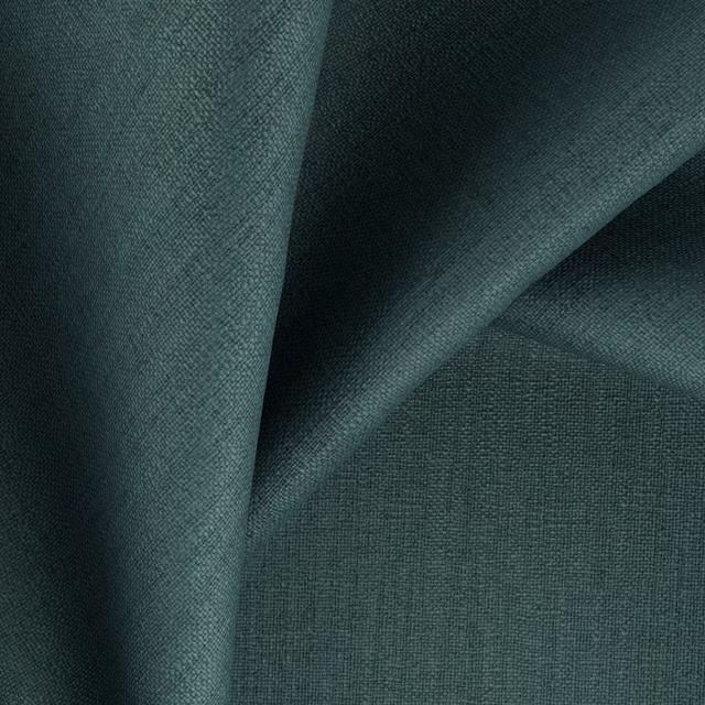 Deep emerald blue-green fabric with a fine woven texture in folded light