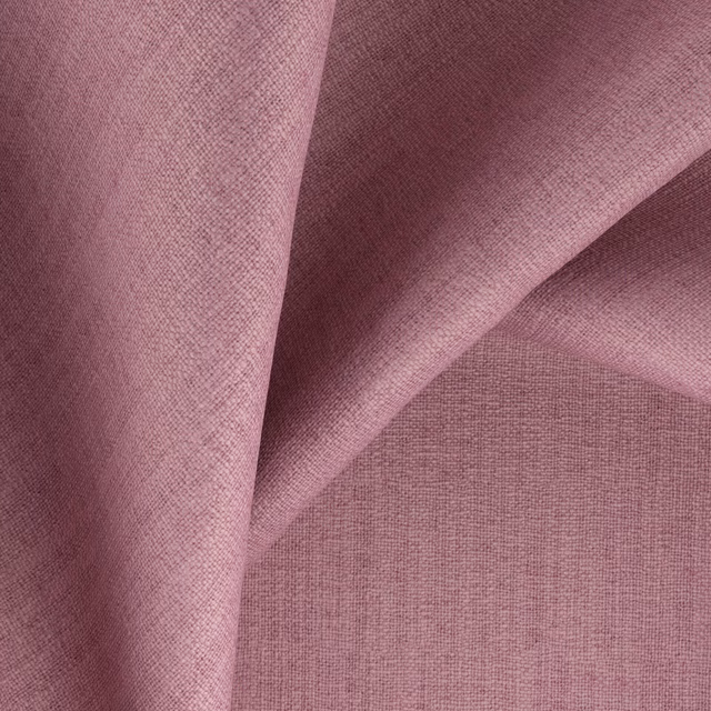 Dusty mauve-pink woven fabric with fine crosshatched texture and folded tonal shading