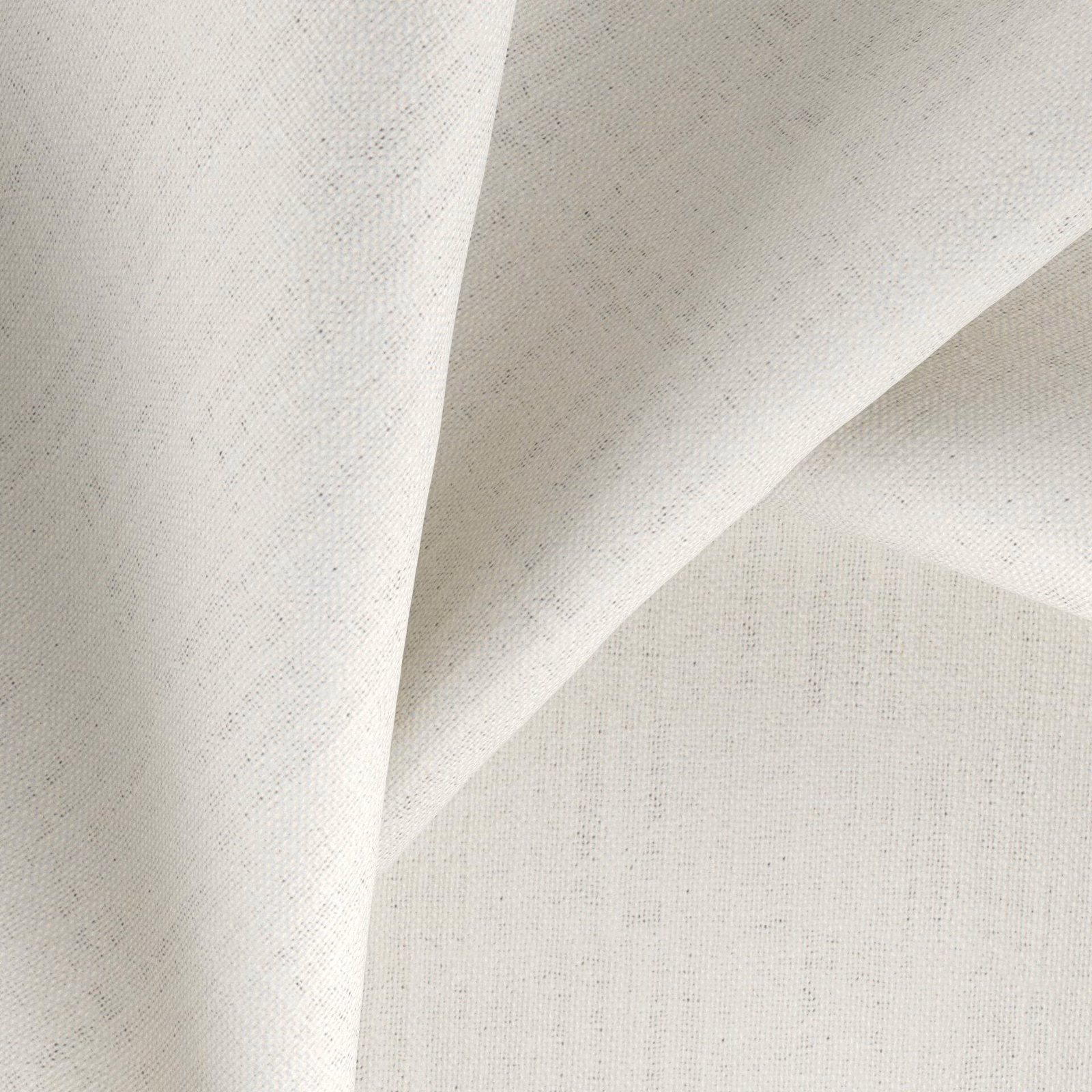Warm ivory-nougat plain weave fabric falling in softly angled folds