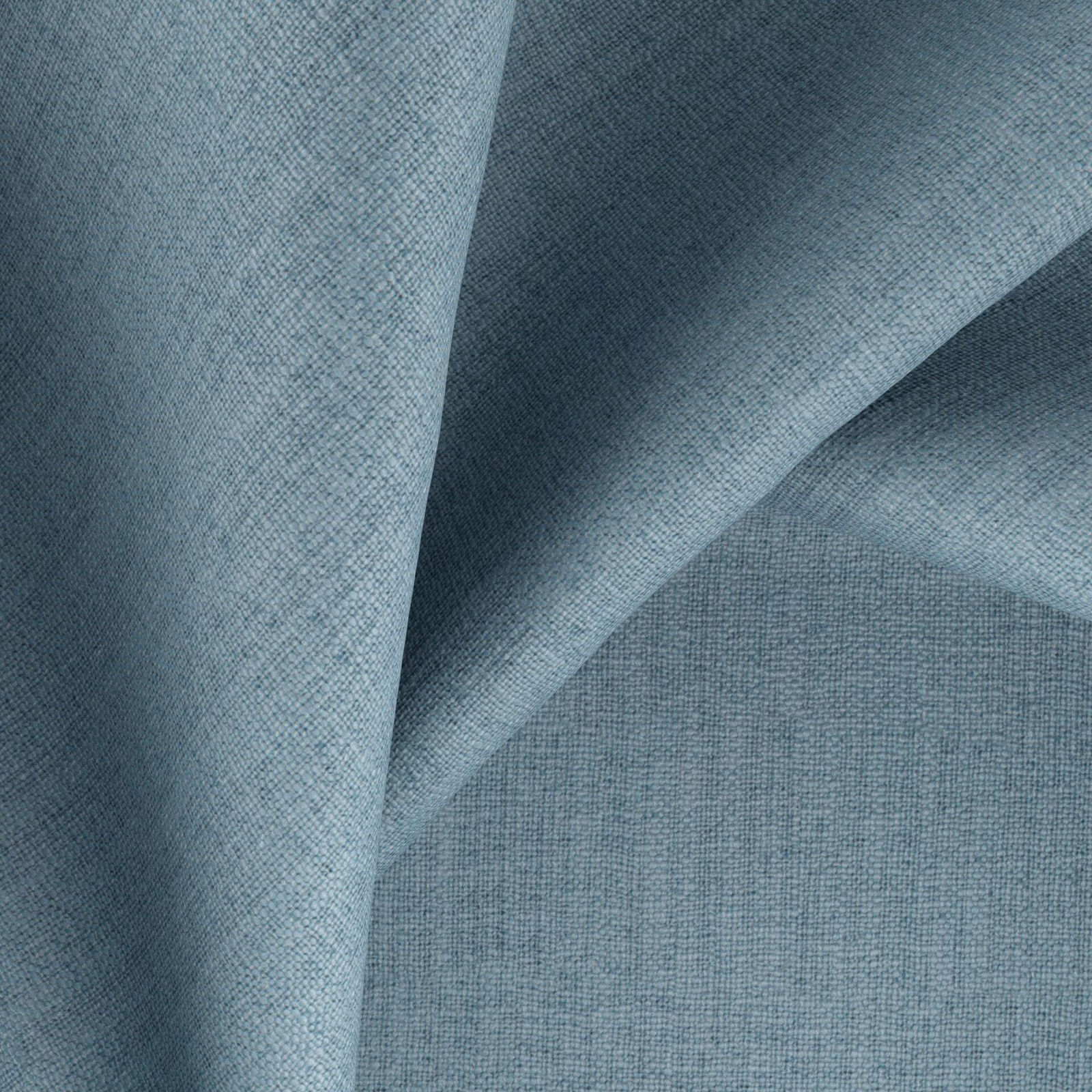 Folded powder-blue fabric showing a fine crosshatch weave and slate-toned shadows