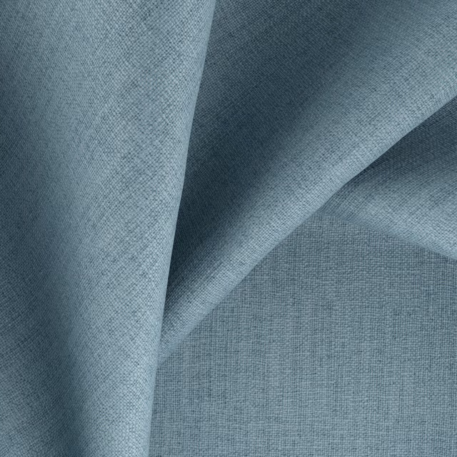 Folded powder-blue fabric showing a fine crosshatch weave and slate-toned shadows