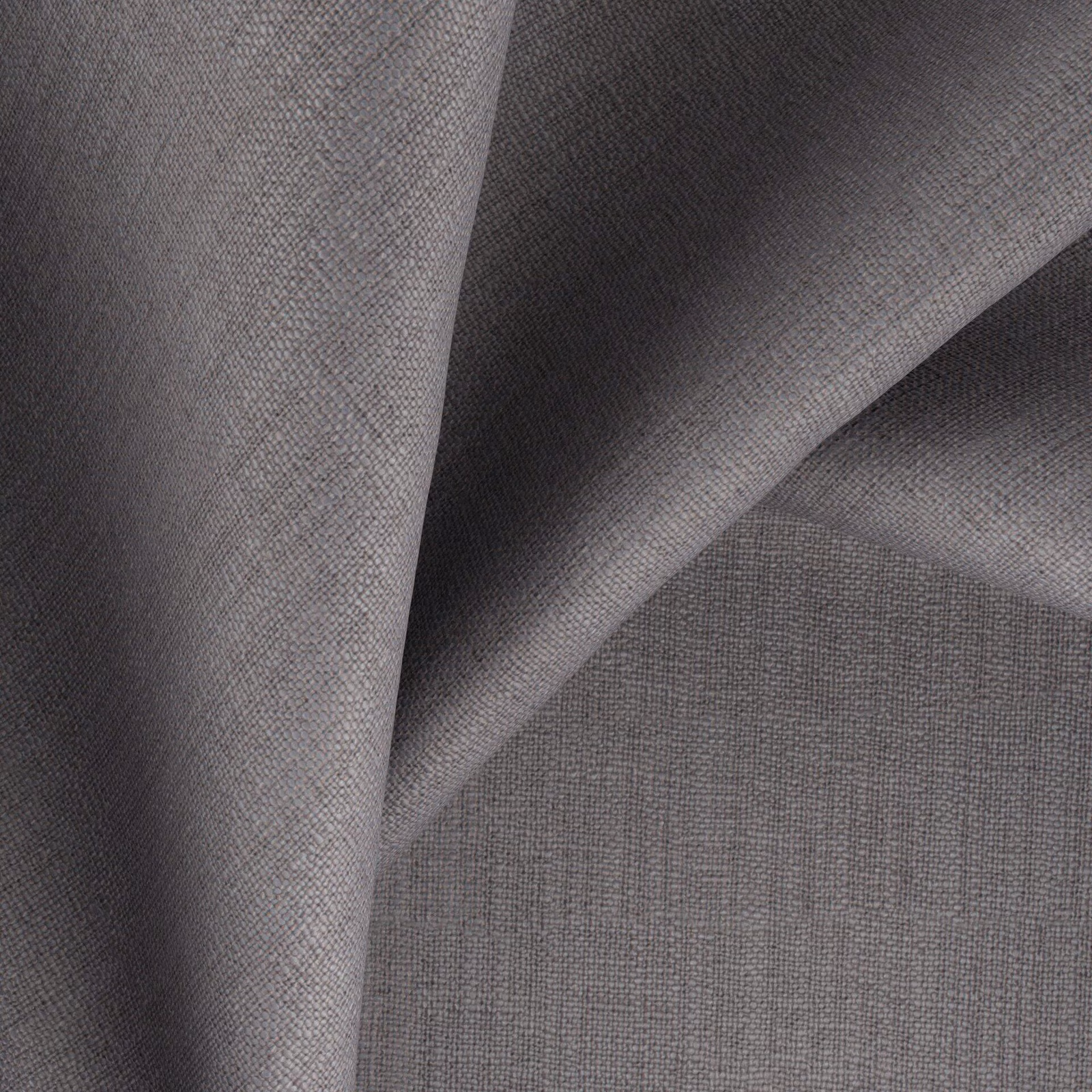 Charcoal mushroom-grey woven fabric folded to show fine texture and tonal light shifts