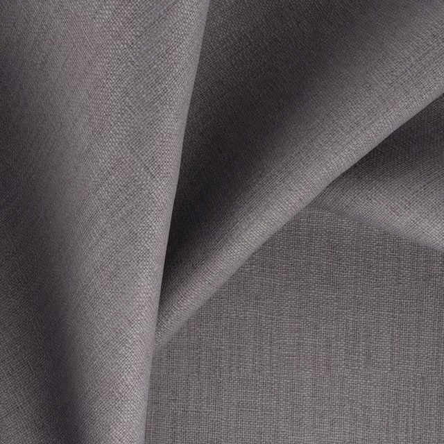 Charcoal mushroom-grey woven fabric folded to show fine texture and tonal light shifts