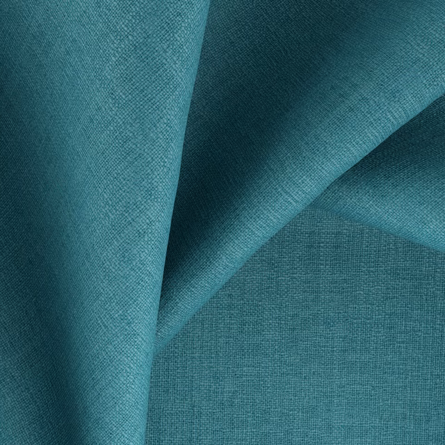 Deep turquoise teal fabric with fine crosshatched weave folded to show tonal depth