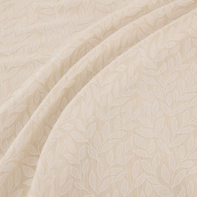 Soft ivory fabric with tonal outlined leaves and gentle draped folds