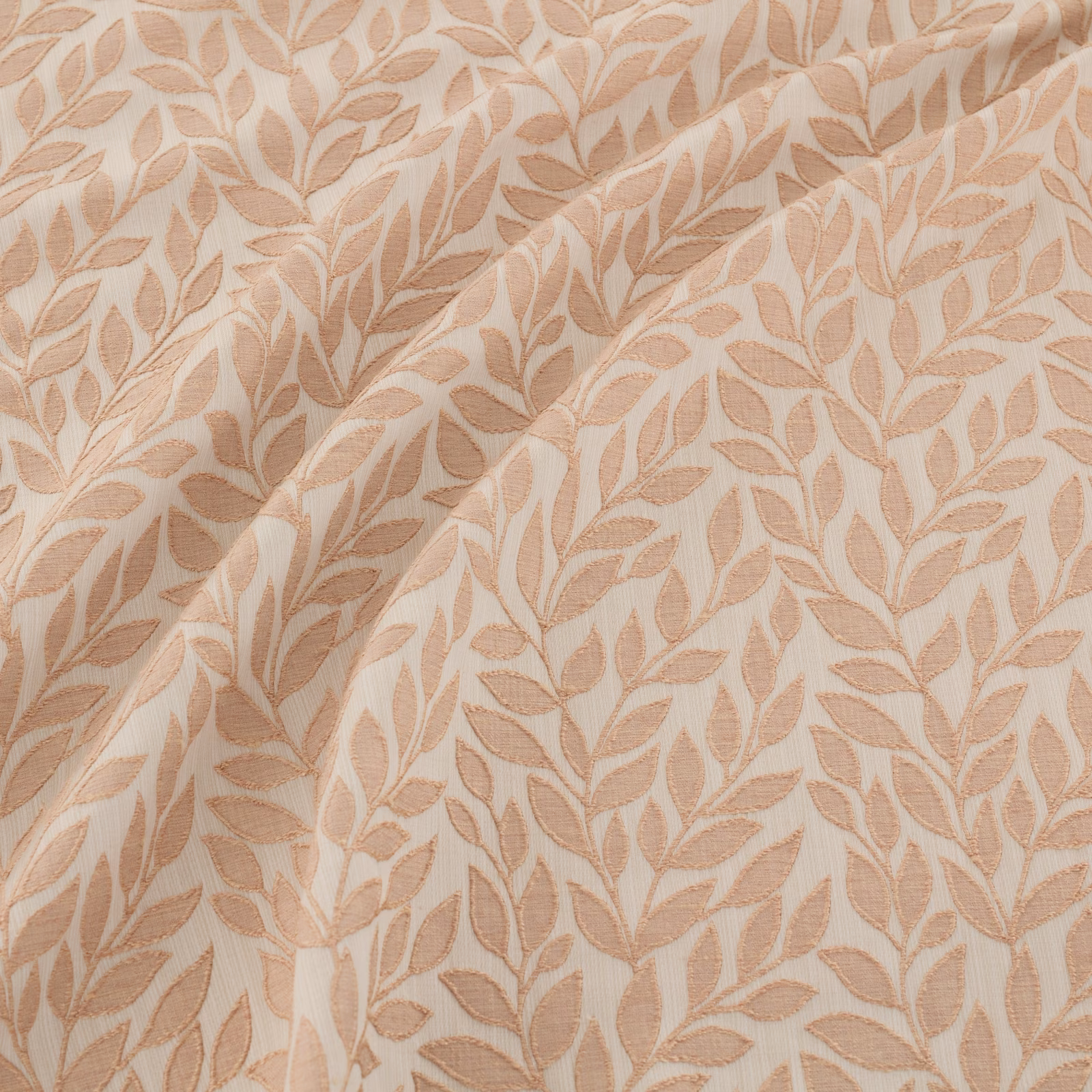 Warm cream fabric with dense blush rose-gold leaf trails and soft folds