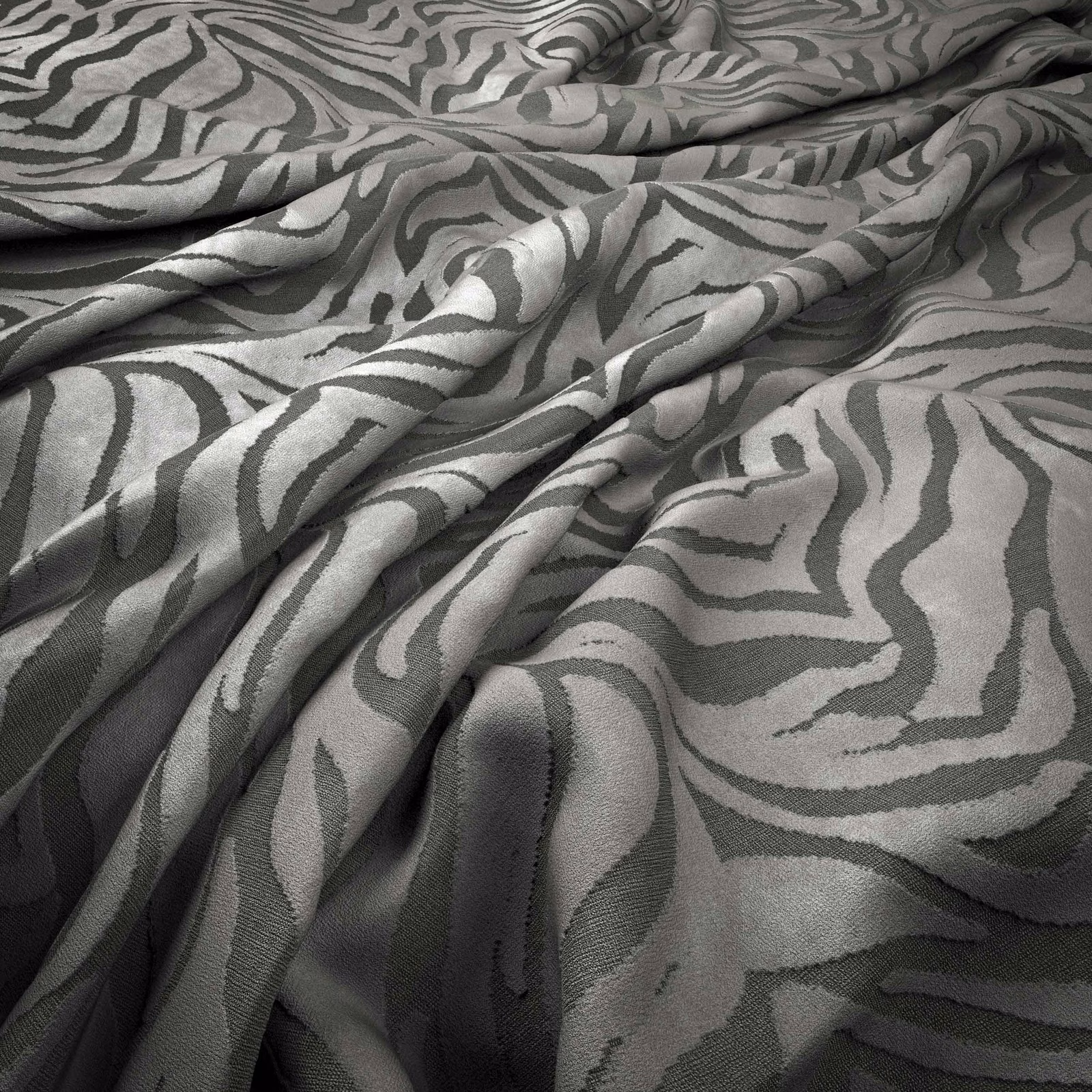 Cool grey-green woven fabric with flowing charcoal zebra stripes in soft folds