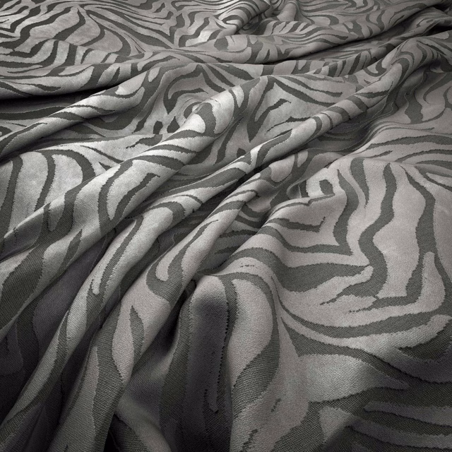 Cool grey-green woven fabric with flowing charcoal zebra stripes in soft folds