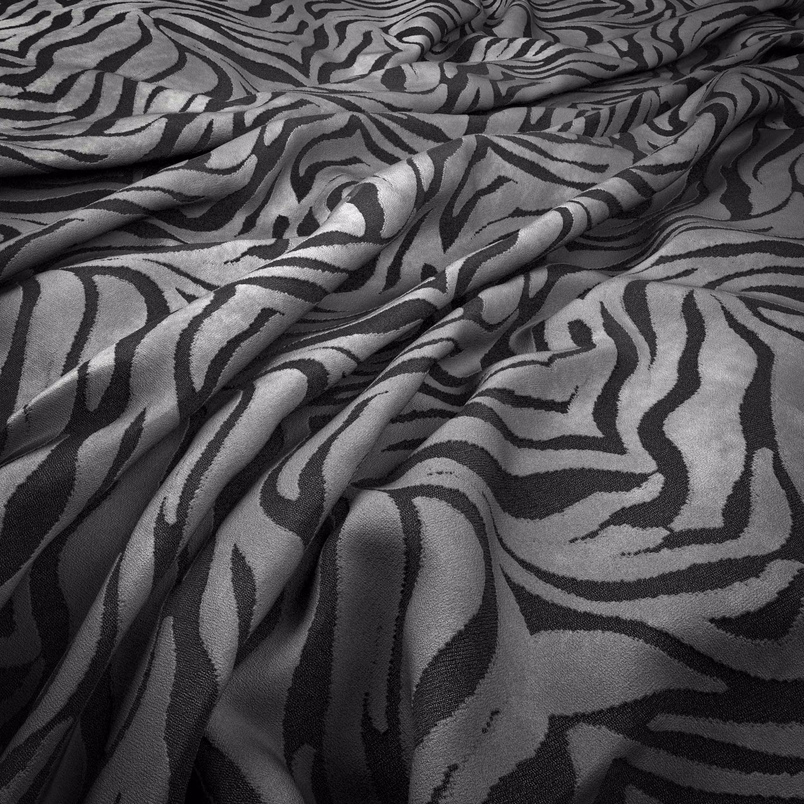 Cool zinc-grey fabric with black organic zebra stripes and soft surface sheen
