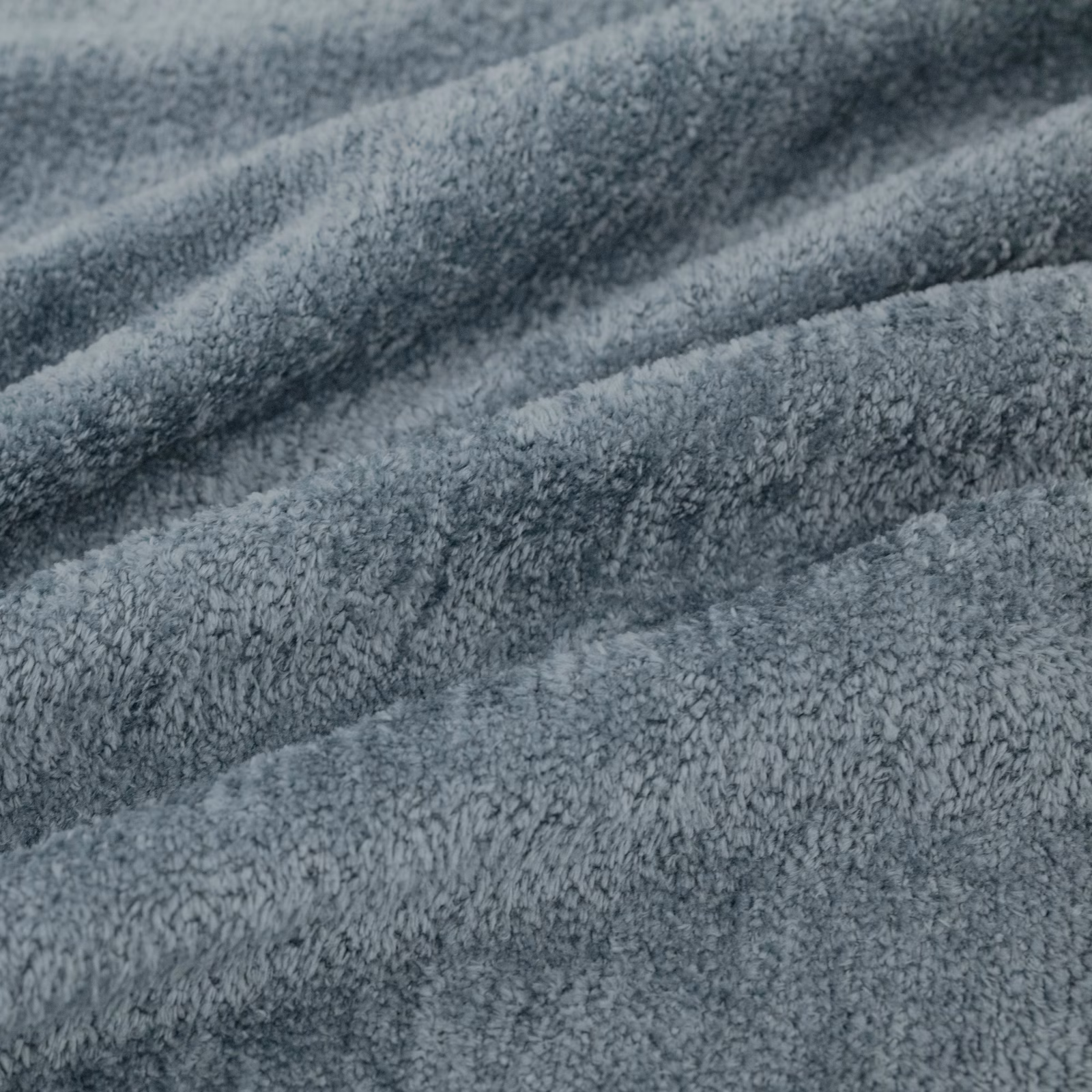 Cool battleship blue-grey plush pile forming soft diagonal folds