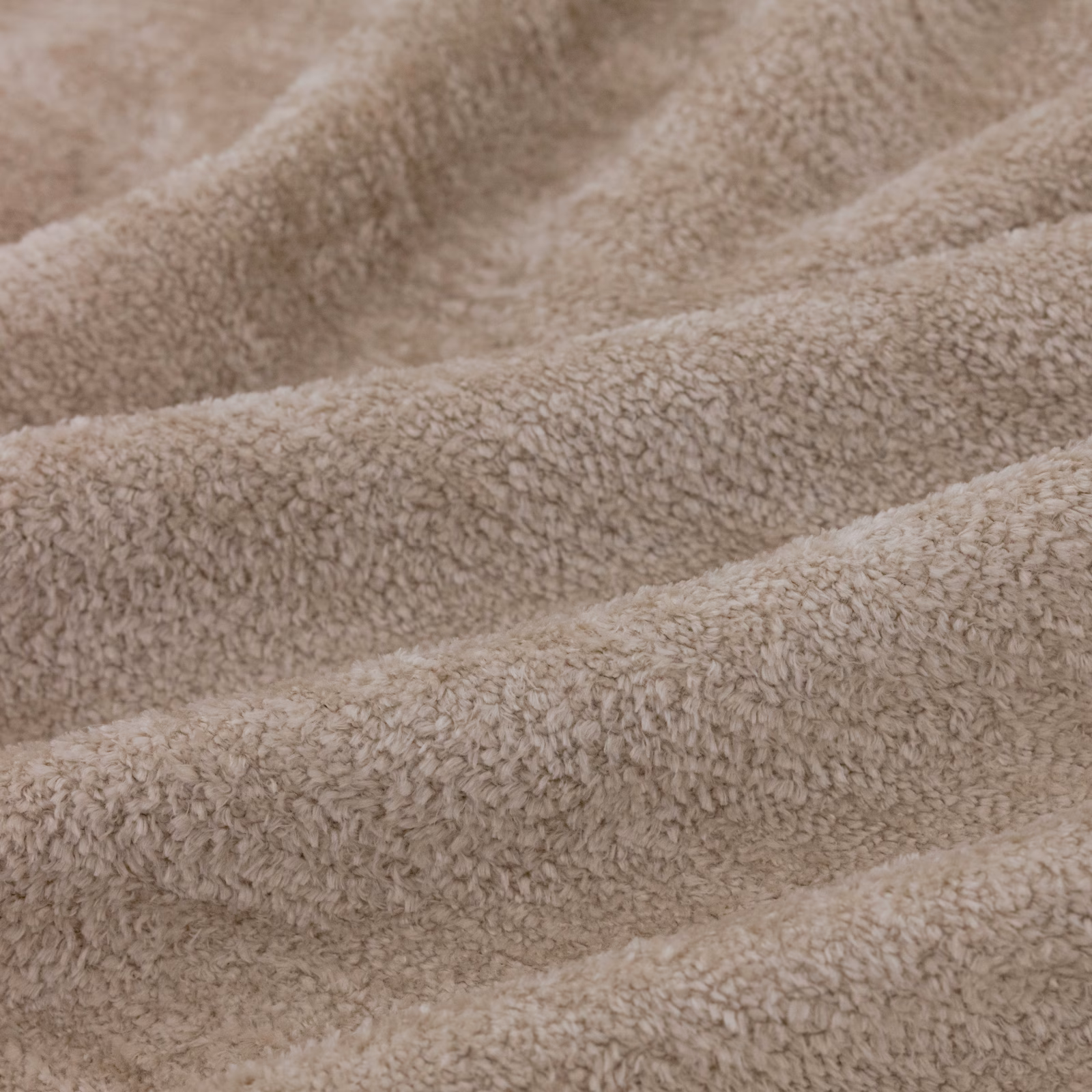 Warm taupe Cecconi Dune swatch with dense nubby pile and softly waved folds