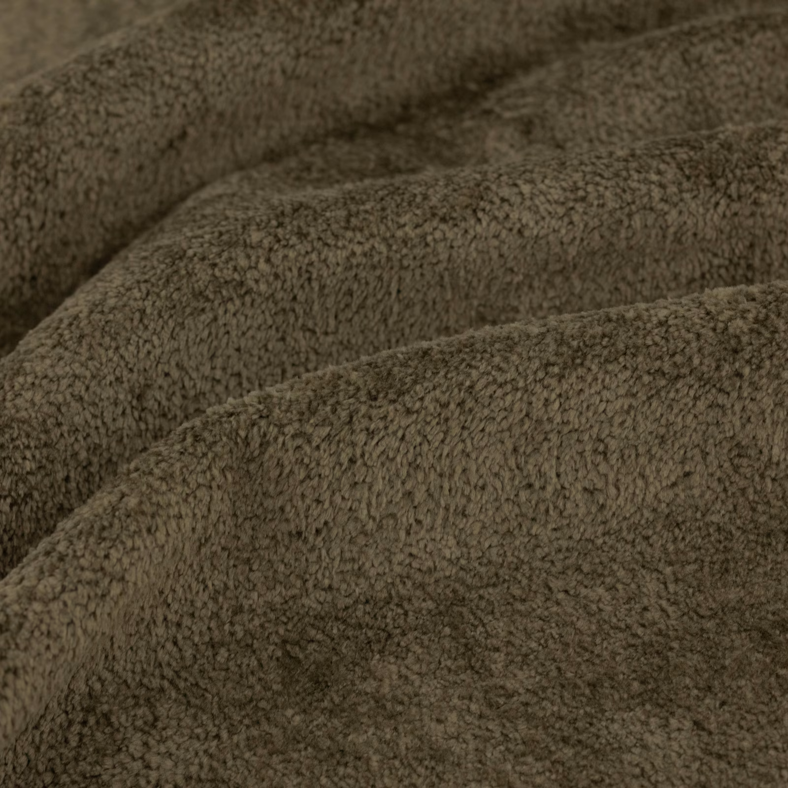 Close view of dense moss-olive looped pile with softly shadowed folds
