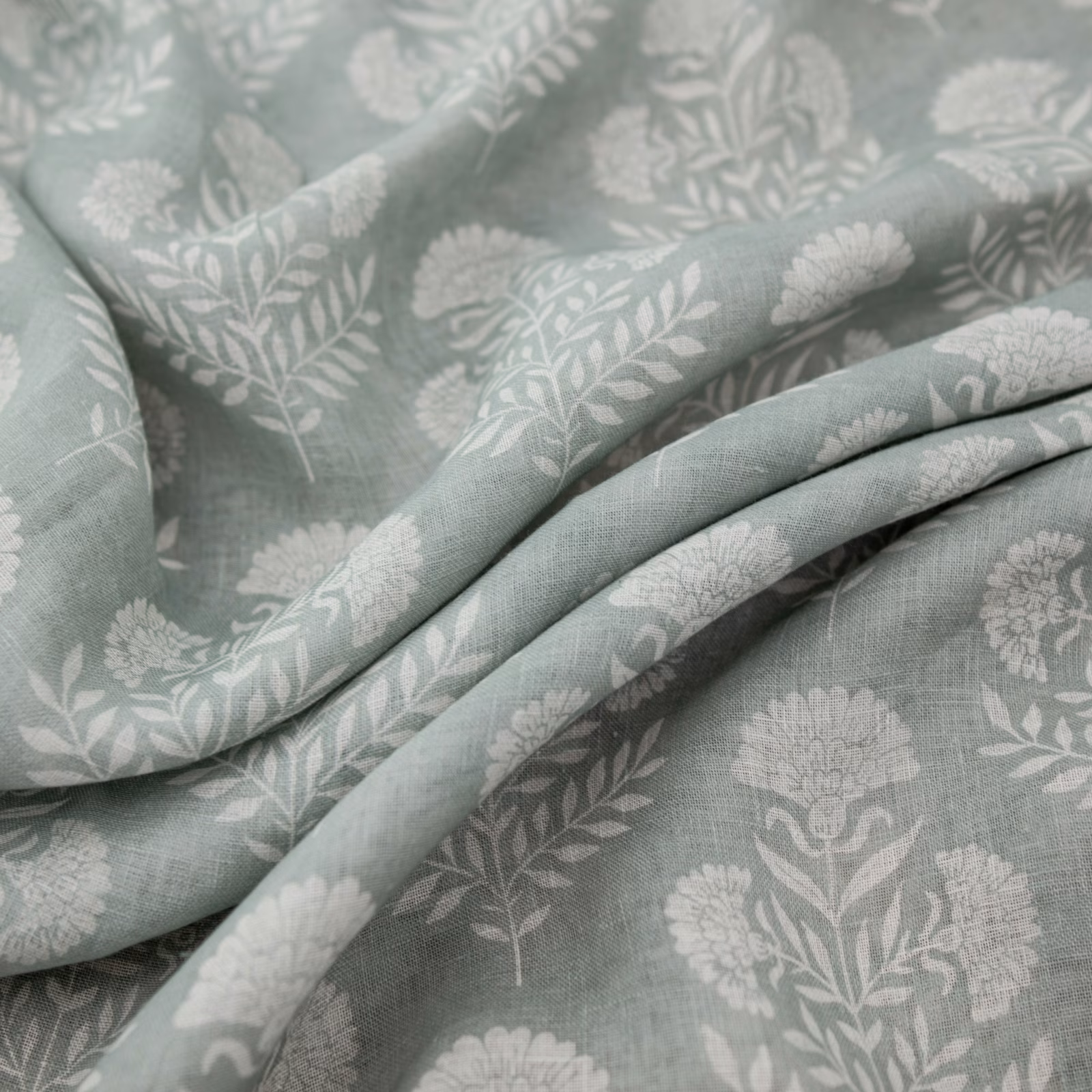 Duckegg blue-green floral fabric with pale botanical sprigs and soft folds