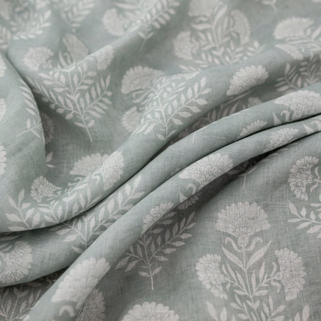 Duckegg blue-green floral fabric with pale botanical sprigs and soft folds