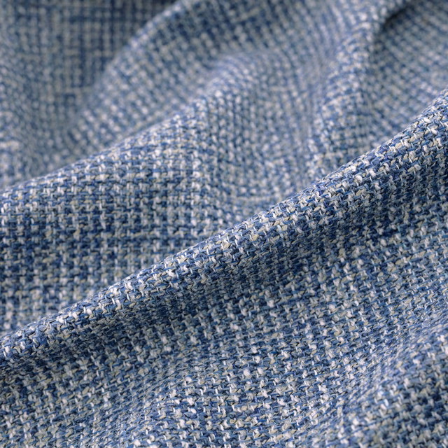 Folded Chanel Indigo swatch showing heathered indigo and pale blue textured weave