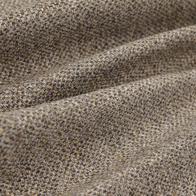 Close-up of taupe-grey Chanel Shingle showing dense braided weave and folded texture