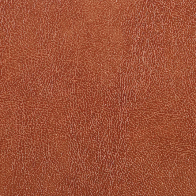 Deep burnt orange textile with fine pale crackle lines and vertical striations