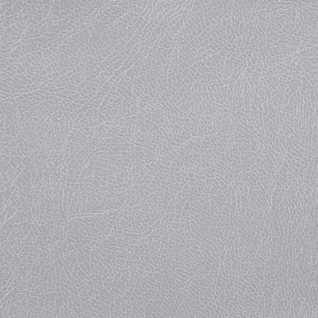 Pale silver-grey fabric with a fine irregular pebbled texture and softly mottled surface