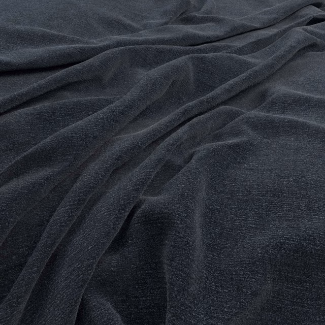 Deep navy fabric with soft directional pile, subtle sheen and folded surface