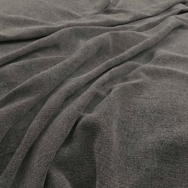 Deep charcoal-grey plain woven fabric arranged in softly shadowed flowing folds