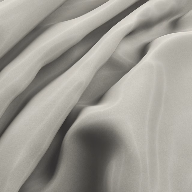 Warm champagne fabric with a smooth lustrous surface flowing through deep folds