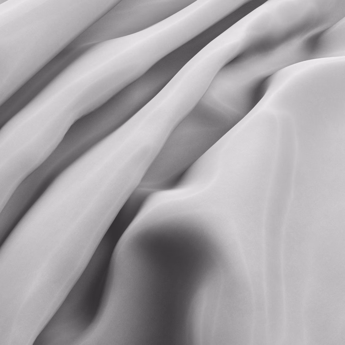 Smooth ivory fabric falling into flowing folds with a subtle lustrous surface