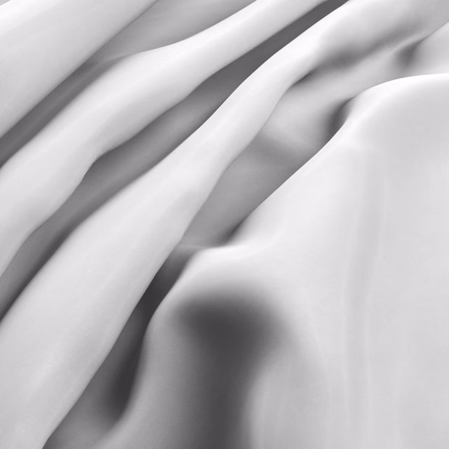 Cool optic-white fabric falling in smooth folds with soft silver-grey shadows