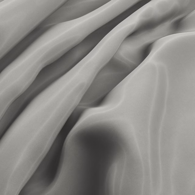 Close-up of smoke-grey fabric falling into fluid folds with a muted sheen