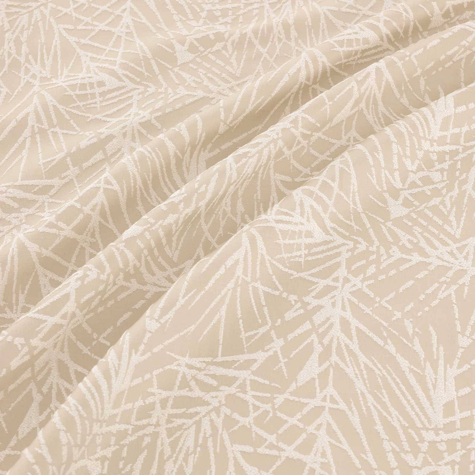Warm beige textile with white branching lines shown across softly folded fabric