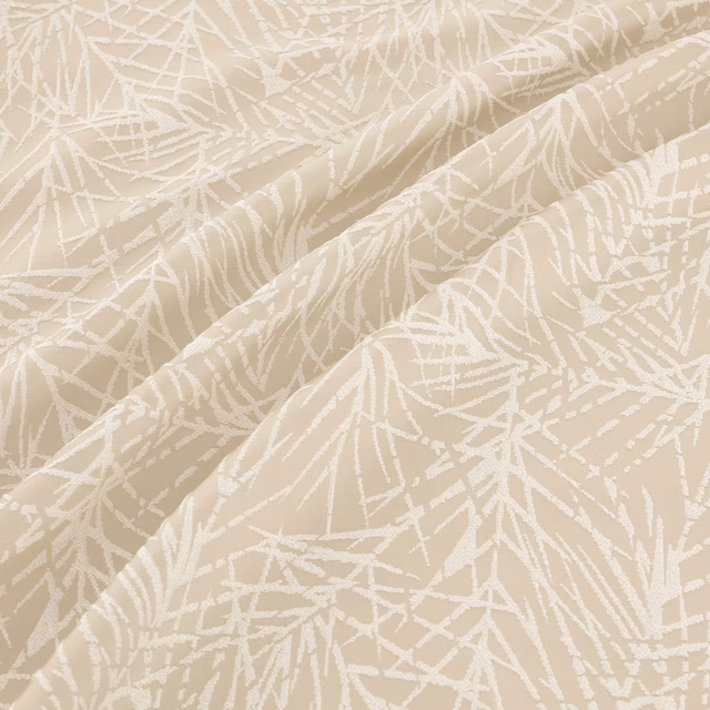 Warm beige textile with white branching lines shown across softly folded fabric