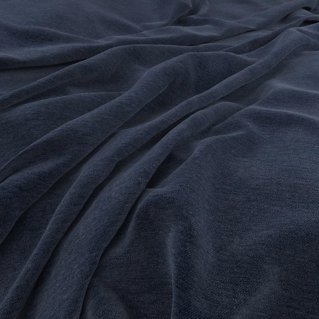 Deep indigo cloth with a softly brushed surface gathered into fluid folds