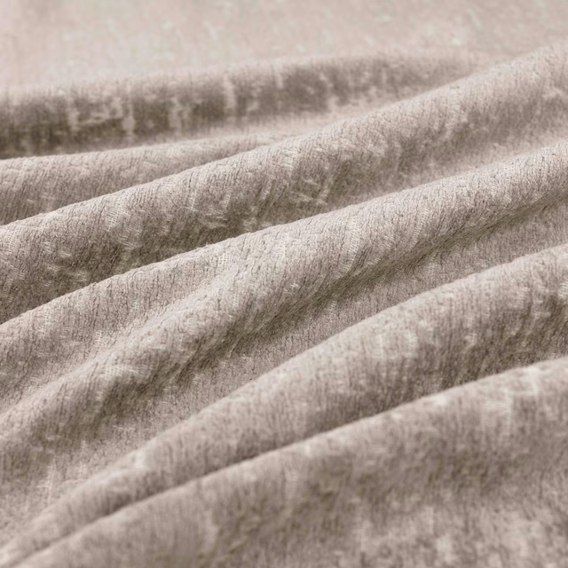 Smoky greige napped fabric with soft cloudy tonal shading in folded drapes