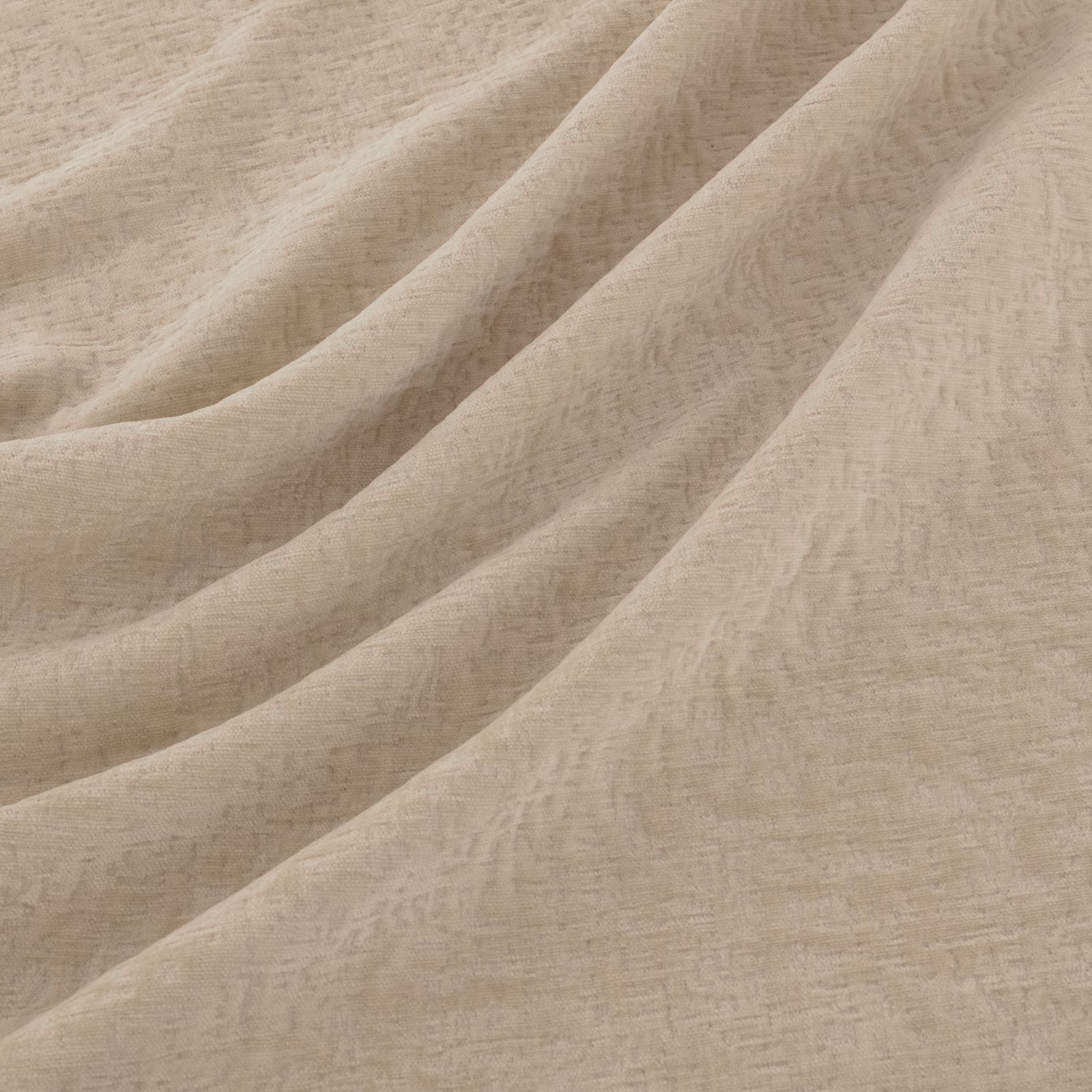 Warm ecru fabric with softly mottled texture falling in broad fluid folds
