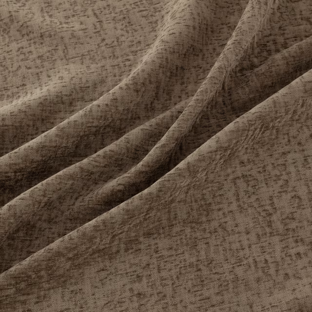 Warm taupe-brown Courchevel textile with irregular distressed marks and softly folded texture