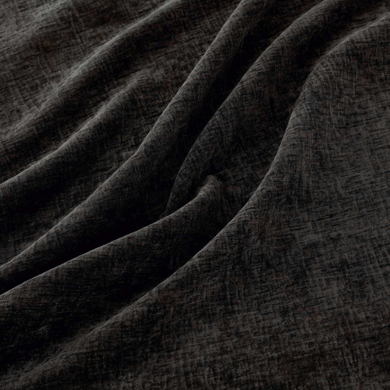 Deep charcoal Magnet fabric with crosshatched texture falling into soft folds