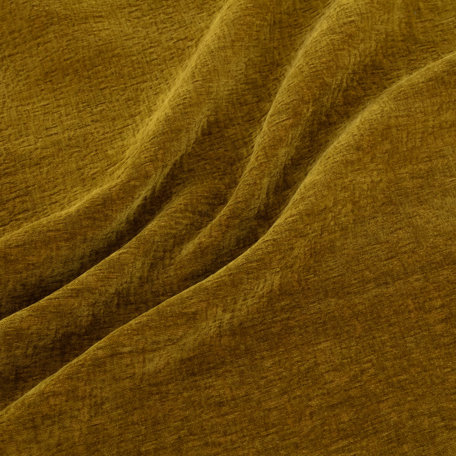 Warm ochre-gold fabric with softly brushed texture and deep draped folds