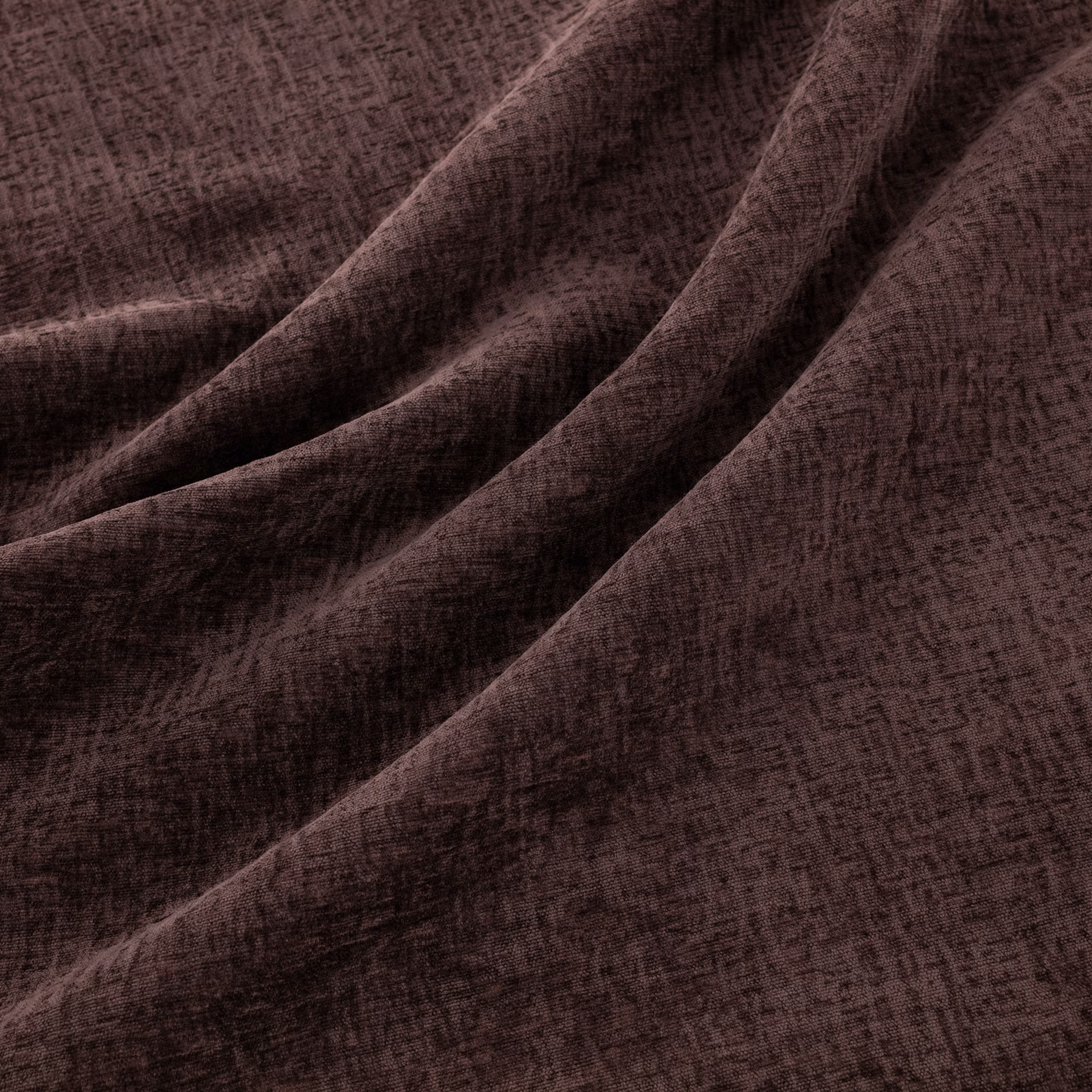 Dark raisin-plum fabric with an irregular crosshatched woven texture in soft folds