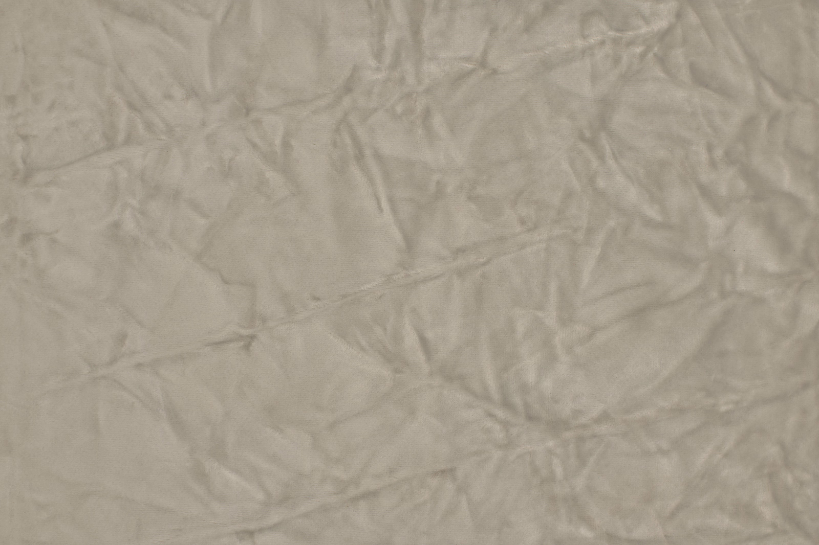 Soft ash grey crumpled plain fabric with a matte, textured surface