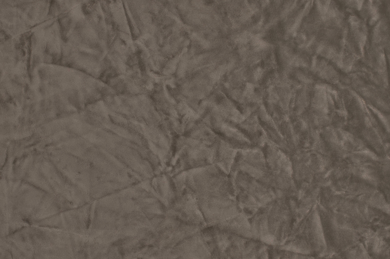 Close-up of softly crumpled taupe polyester fabric with subtle sheen