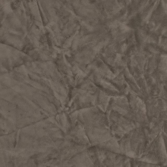 Close-up of softly crumpled taupe polyester fabric with subtle sheen