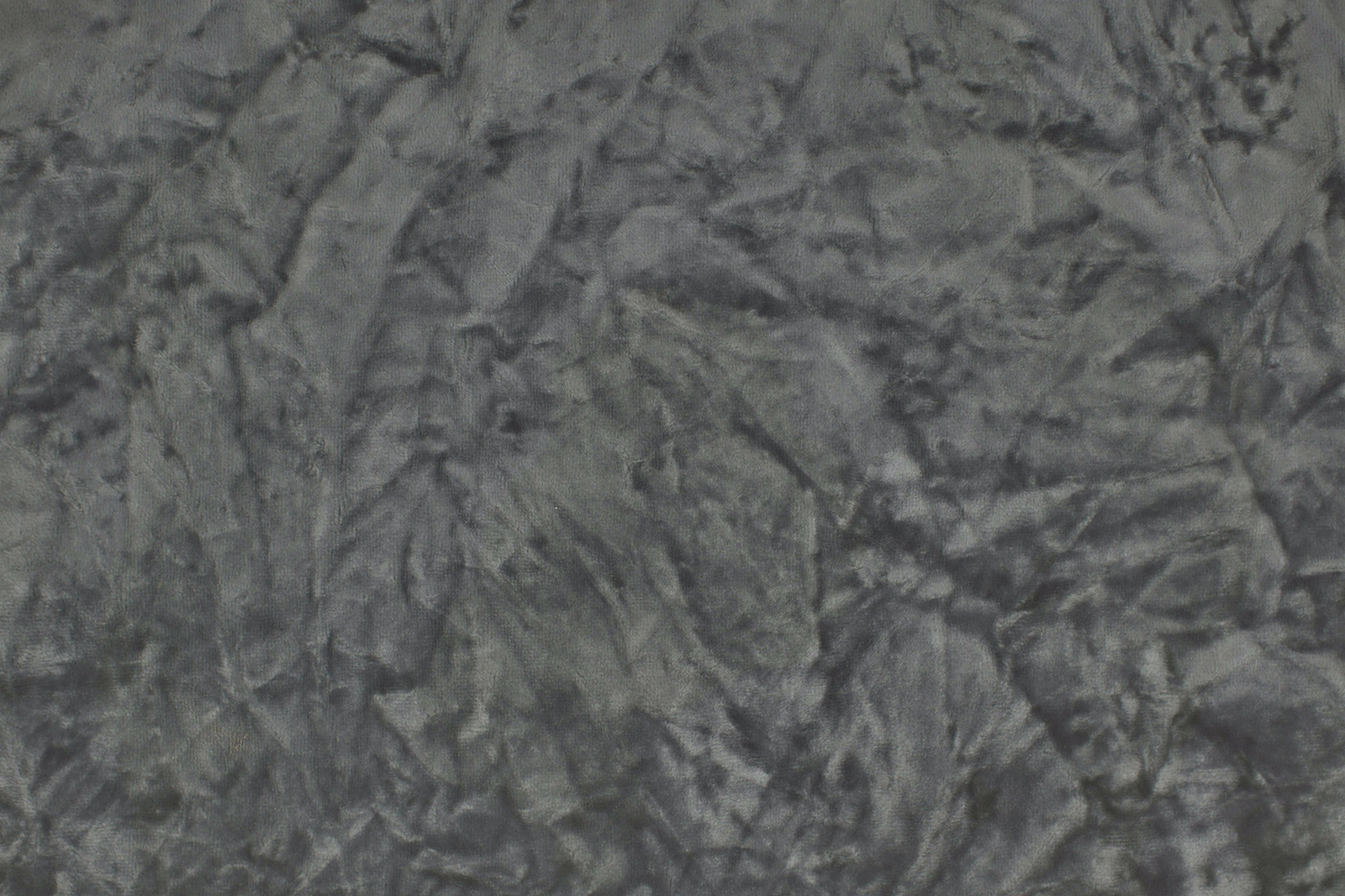 Crinkled plain fabric in smoky steel grey with a rumpled textured surface