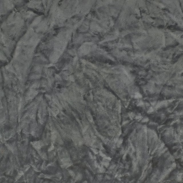 Crinkled plain fabric in smoky steel grey with a rumpled textured surface