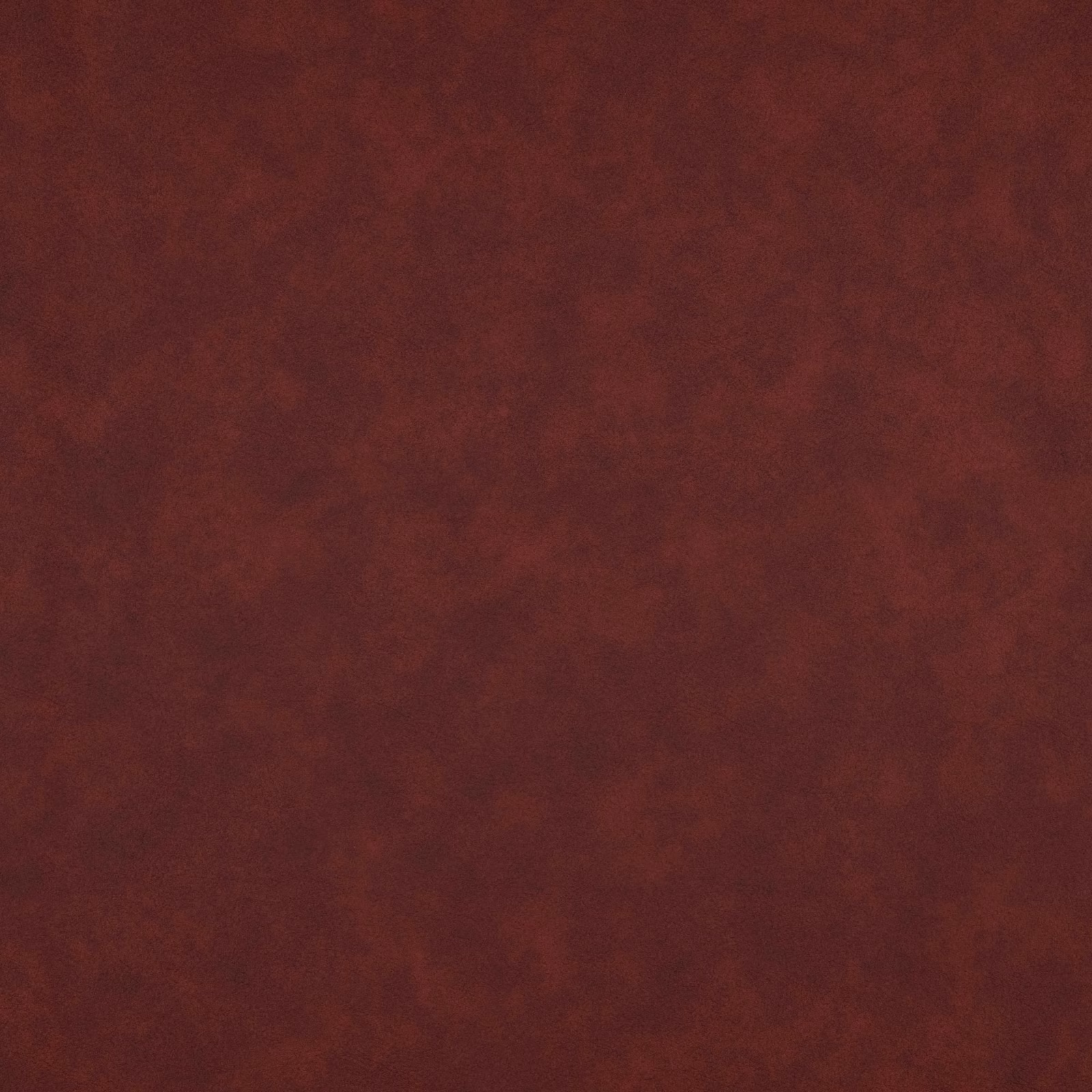 Deep oxblood burgundy Cuero fabric with a softly mottled, suede-like surface