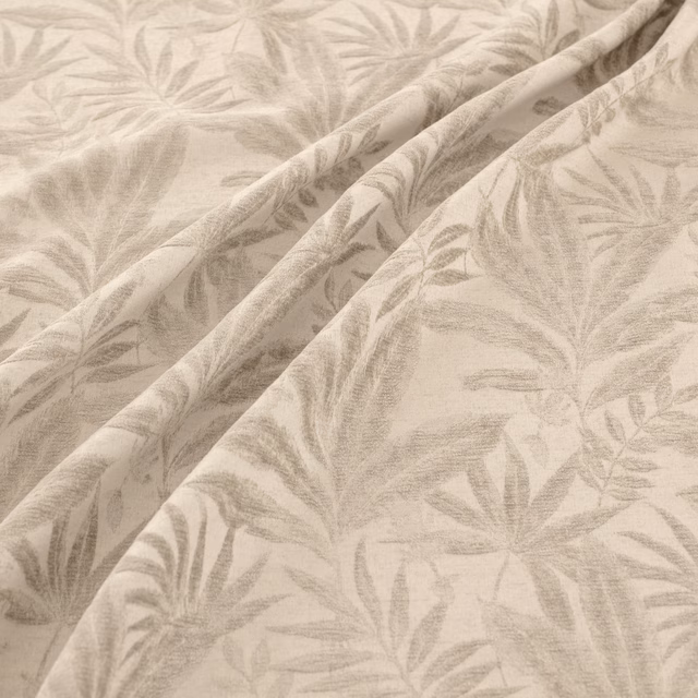 Warm sand fabric with washed grey botanical leaves and soft woven texture